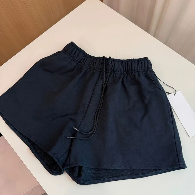 Short de sport ample uni à taille élastique